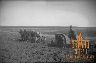 Photographic negative, Joe Gardner with horses helping his John Deere, 1932