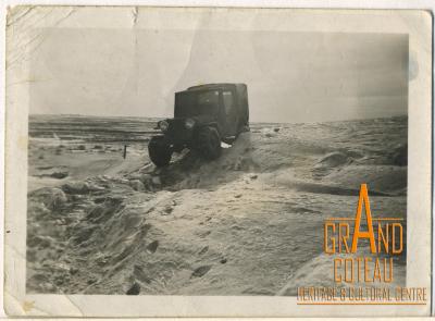 Photograph, Hymie Hanft's Jeep travelling over snow banks between Shaunavon and Gull Lake, February 1947