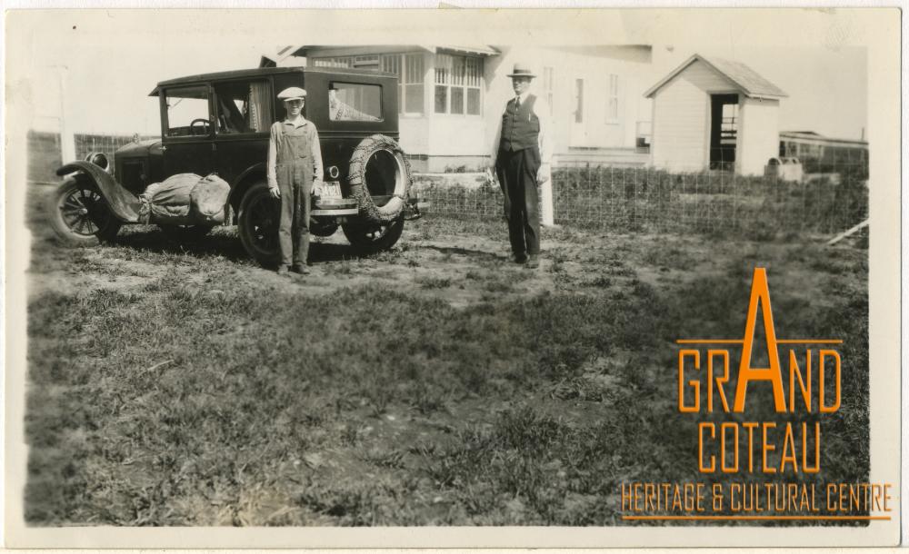 Photograph, Leonard and father, Albert 'Doc' Hanft in front of their farm house, 1928