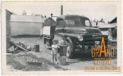 Photograph, young children Larry and Lana Hanft washing their father Len Hymie Hanft's truck, 1953