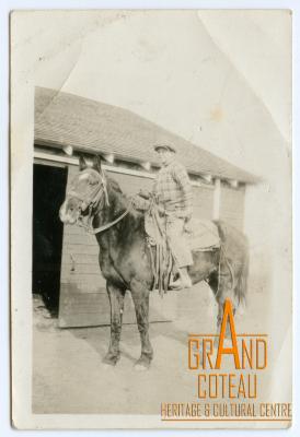 Photographic Print, unidentified man posing on horse