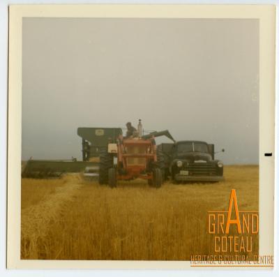 Photographic print, Joe Richtik harvesting on a combine