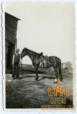 Photographic Print, unidentified man posing with horse