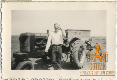 Photograph, Len Hymie Hanft beside his new Allis-Chalmers tractor, 1940