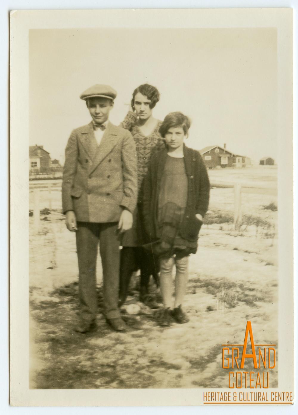 Photographic Print, unidentified young man, woman and girl