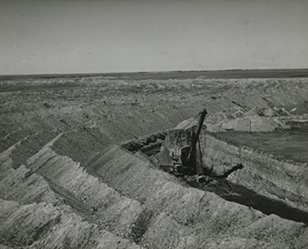 SK: Bienfait -- Removing overburden from a seam of coal at open-face coal mine.