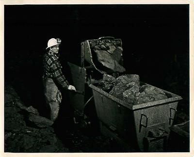 SK: Beaverlodge - Eldorado Mine: Saul Chub is a miner operating mucking machine at a face.