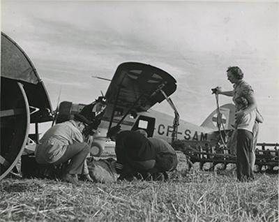 SK: Melville area - World’s first air ambulance service.  At a farm implement accident, pilots and nurse pick up injured farmer