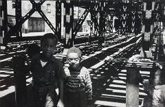 Untitled (children under elevated tracks)