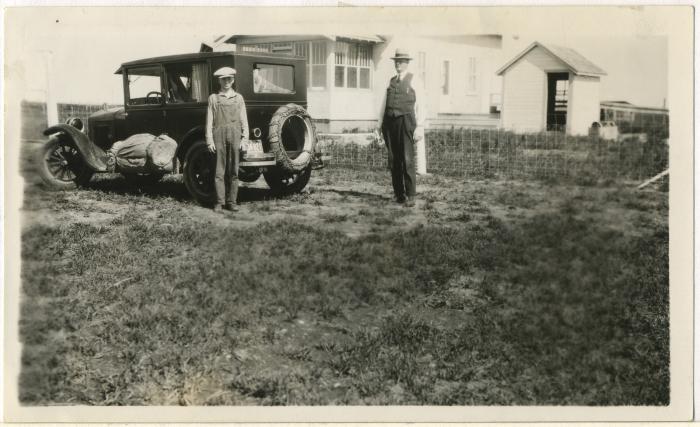 Photograph, Leonard and father, Albert 'Doc' Hanft in front of their farm house, 1928