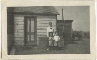 Photograph, Leonard 'Hymie' Hanft, mother Martha Hanft, and Miss Gerber in front of farm house