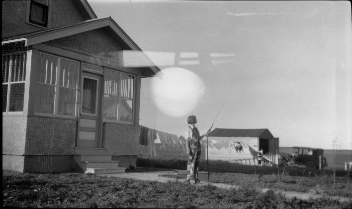 Photographic negative, Dorothy Akins (Baugh) at Hanft farm in 1928