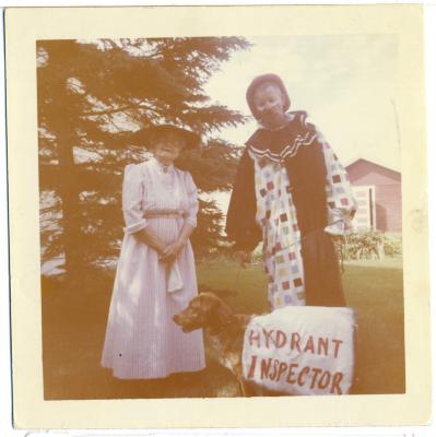 Photograph, Hymie Hanft and Mrs. Frank Bransted (Catherine) with dog, dressed in costume for the 1963 Jubilee parade