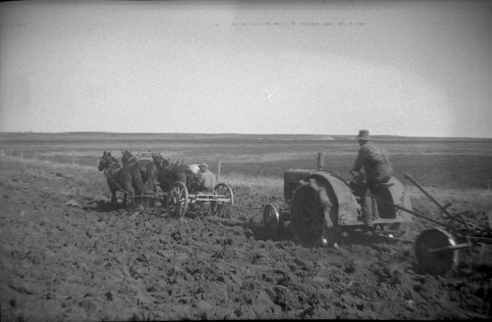 Photographic negative, Joe Gardner with horses helping his John Deere, 1932