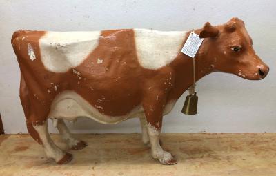 Cow - Made of paper mache. Gift of David Aldous and sister Joyce Badham nee Aldous. This cow was used in a store window in Weyburn as "Elsie the Cow" for Borden Milk. It was seen there by Joyce whose group of Sunday School girls were sponsoring a program of milk as a missionary undertaking. She thought if she could borrow the cow to use at the church tea the proceeds could be deposited in a milk bottle. The store agreed telling Joyce to keep it until the salesman called to pick it up. No one ever came.