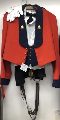 RCMP Red Dress Uniform - Short red jacket, navy vest, white dress shirt, navy pants with yellow stripe and suspenders, white gloves and black bow tie