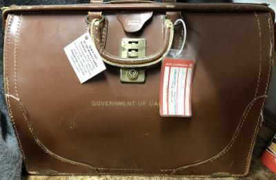 RCMP Brown Leather Brief Case - Government of Canada written on the side -flap loose inside of bag (broken off)