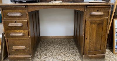 Oak Desk - Came from the former town office - 5 drawers - 1 divided cupboard - 1 secret cupboard (mostly used to hide liquor bottles)