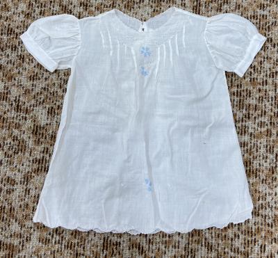 Child's shirt with two blue flowers on front