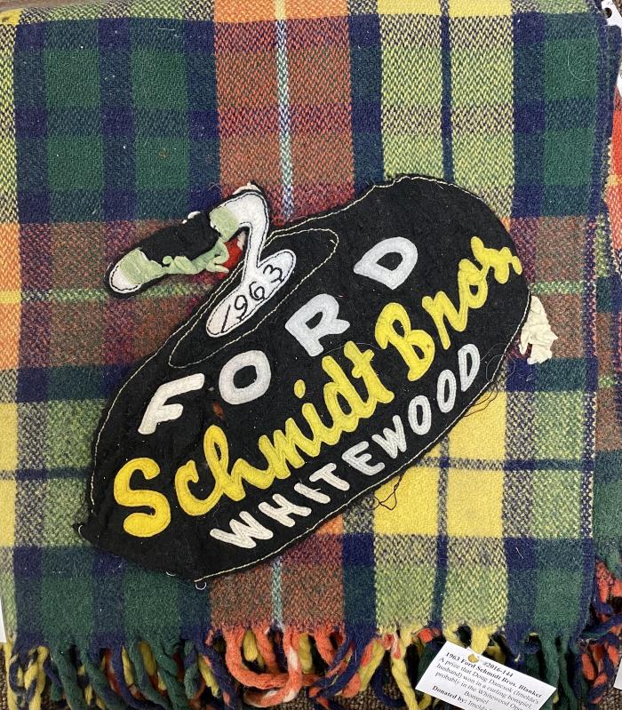 1963 Ford Schmidt Bros. Blanket - A prize that Doug Dancsok (Imelda's husband) won in a curling bonspiel, probably in Whitewood Open Bonspiel