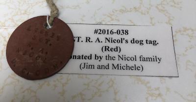 SGT. R. A. Nicol's dog tag. (Red)