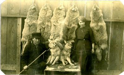 Man and Women with Coyote Pelts and Pups