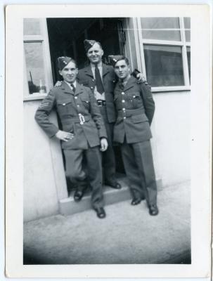 Photographic Print, unidentified men in uniform, soldiers, standing in a doorway.