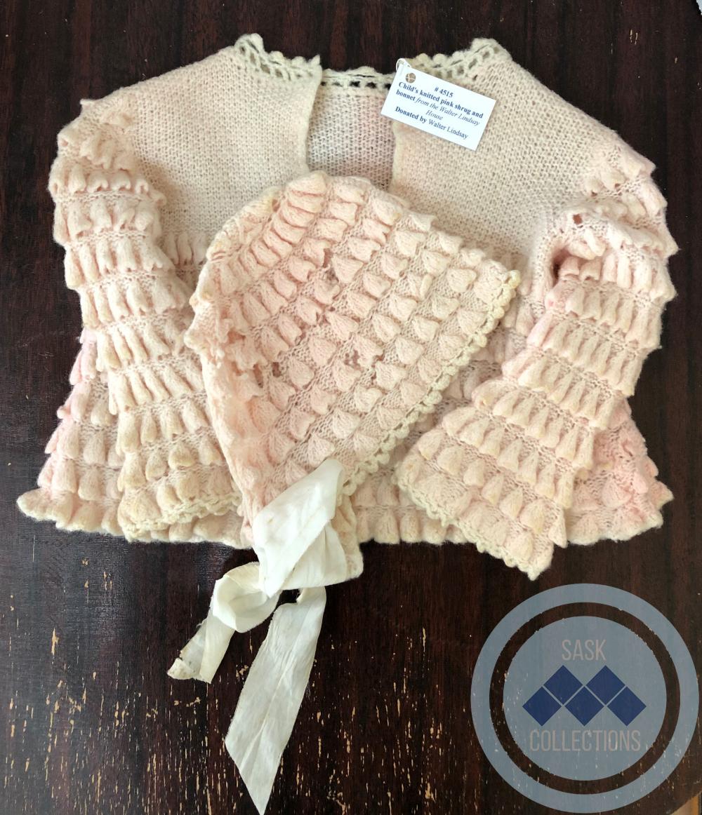 Child's knitted pink sweater and bonnet from the Walter Lindsay house