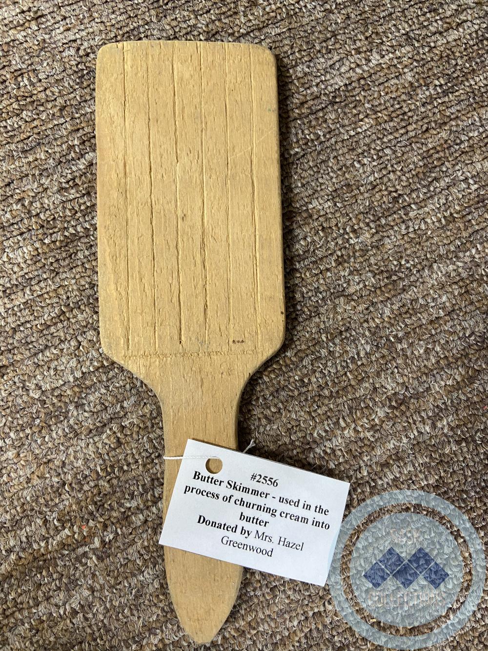 Butter Skimmer - used in the process of churning cream into butter