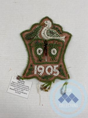 Bead work. Made by and belonged to Hilda Sandberg. Beaded to recognize the formation of Saskatchewan into a province in 1905.