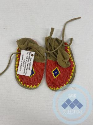 Beaded baby moccasins: <i>made by Lucille Kenny, used by Sasha Bear</i>