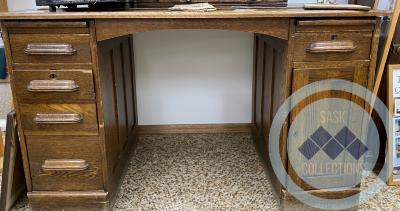 Oak Desk - Came from the former town office - 5 drawers - 1 divided cupboard - 1 secret cupboard (mostly used to hide liquor bottles)