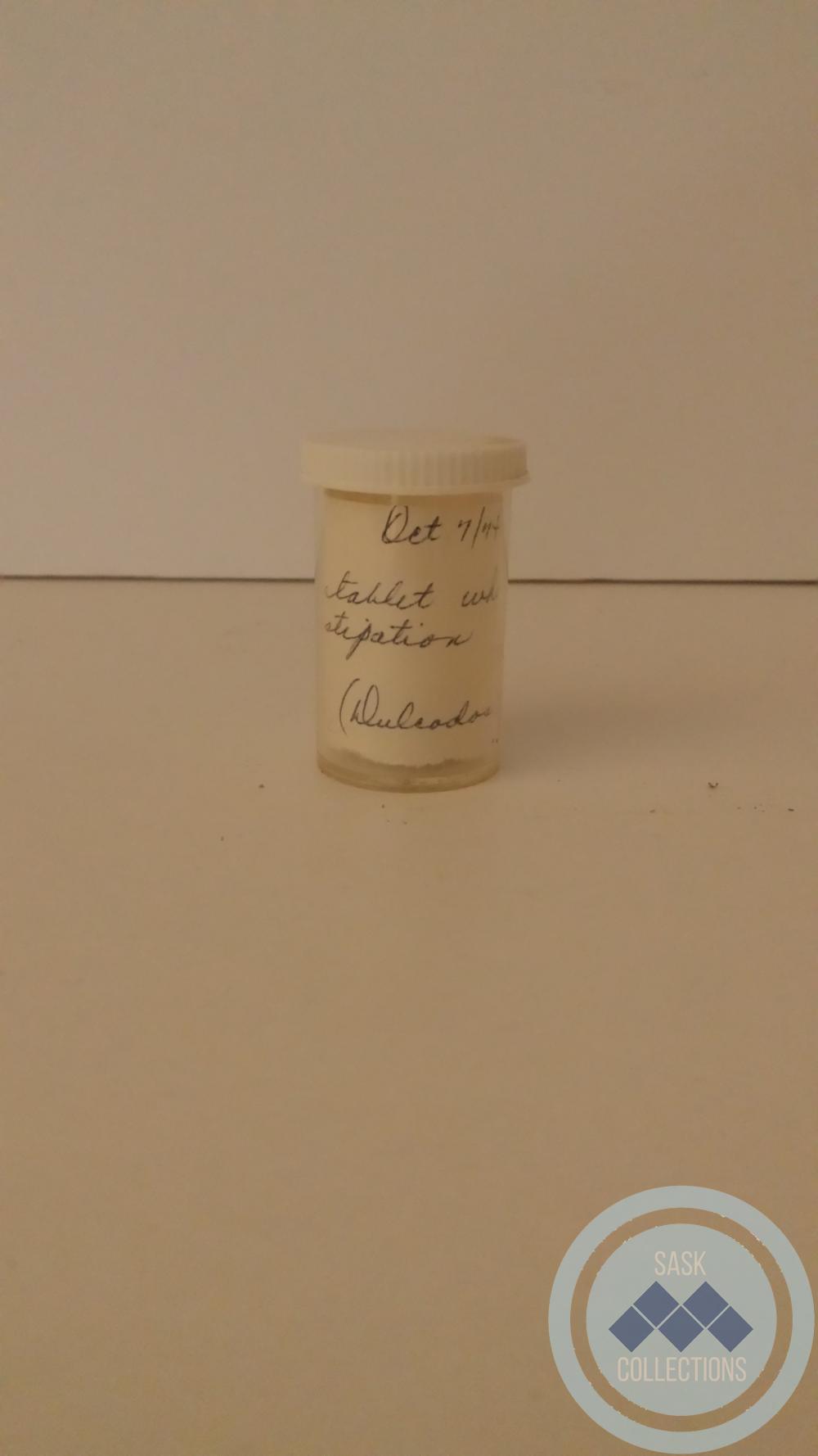 A white small pill capsule. 