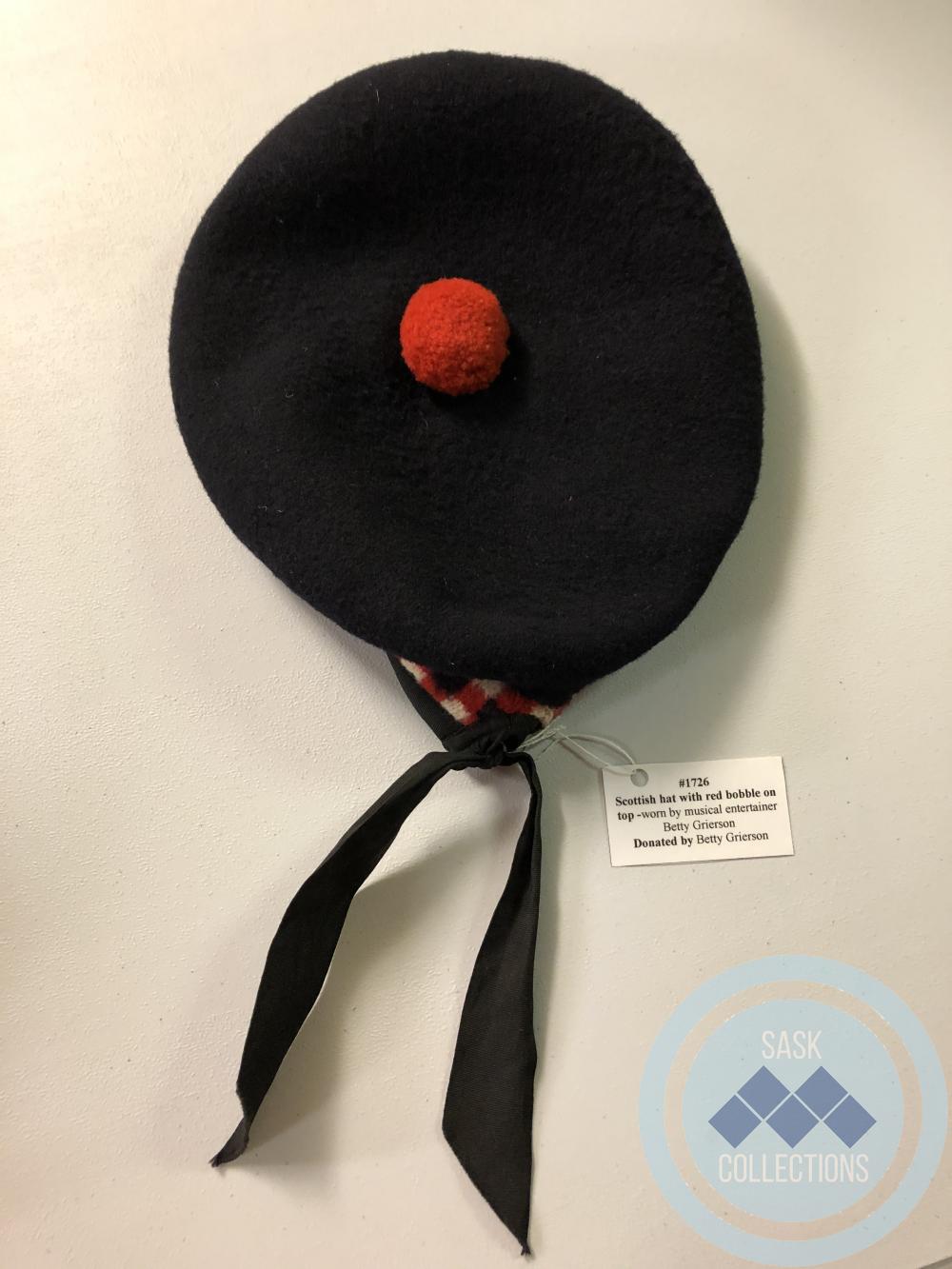 Scottish hat with red bobble on top - worn by musical entertainer Betty Grierson