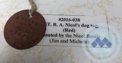 SGT. R. A. Nicol's dog tag. (Red)