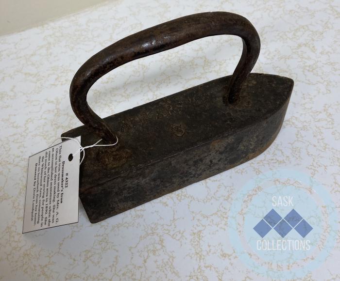Dressmaker's Iron  - This flat iron was used by my grandmother Mrs. A. G. Olson in her dress making. She was an accomplished seamstress when she came to the Ohlan area in 1890. She did much of her sewing for people in the Whitewood Area, commuting there on horseback from her home