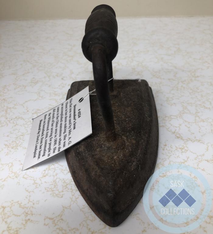 Dressmaker's Iron - This flat iron was used by my grandmother Mrs. A. G. Olson in her dress making. She was an accomplished seamstress when she came to the Ohlan area in 1890. She did much of her sewing for people in the Whitewood Area, commuting there on.