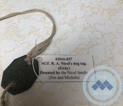 SGT. R. A. Nicol's dog tag. (Gray)
