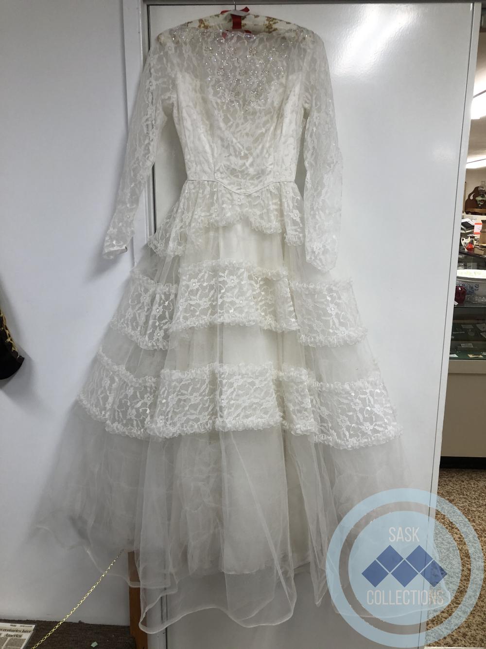Lace Wedding Gown- was worn by Joan Johnson, who married Fred Harrison in Sept. 1958 (parents of Joan were Charlie and Winnifred Johnson). 