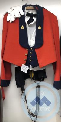 RCMP Red Dress Uniform - Short red jacket, navy vest, white dress shirt, navy pants with yellow stripe and suspenders, white gloves and black bow tie